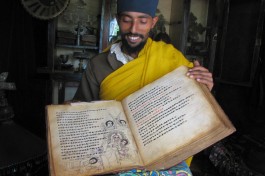 Lake Tana monastery monk with manuscript 