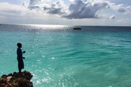 Zanzibar sea and local boy 