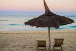 Traditional straw beach umbrella on beach Anakao, madagascar