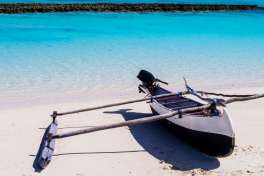 Typical pirogue moored on turquoise reef of nosy ve island, 