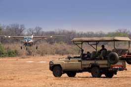Game viewing with safari vehicle and aeroplane 